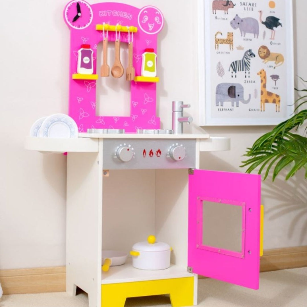 Cocina de juguete de madera con accesorios rosada de 75x52x27cm